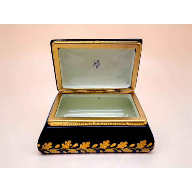 Rectangular jewelry box in authentic French Sèvres porcelain, featuring the iconic, deep "Cobalt Blue" (Bleu de Roi)...