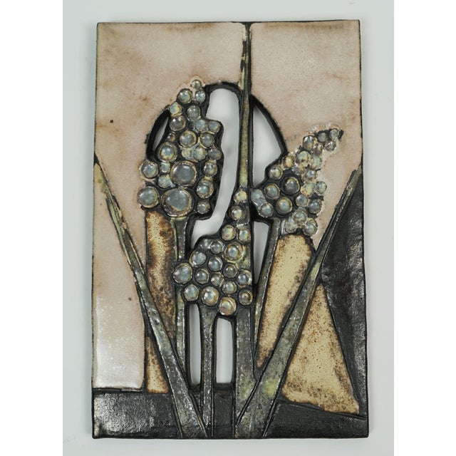 Two beautiful and decorative wall ceramics by Ruscha-Keramik, West-Germany from the 1970s. Various floral motifs in a...