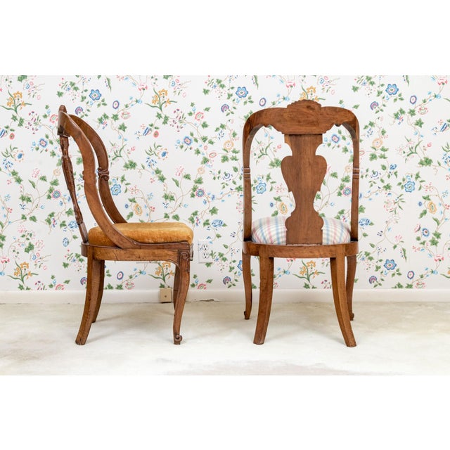 A wonderful pair of antique Italian intricately carved walnut side chairs with with jardinière-shaped back splats and...