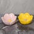 A pair of petal-shaped small bowl. Featuring a petal design with delicate veining, these pieces offer a fresh...