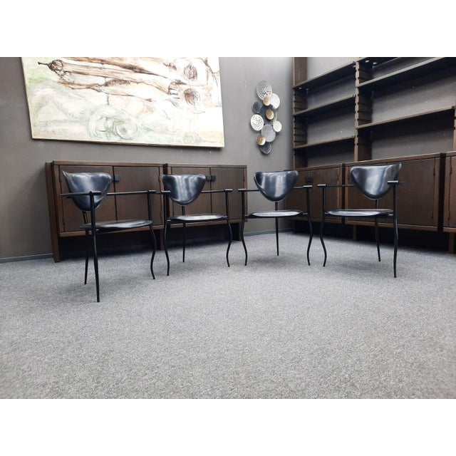 Postmodern dining chairs by Arrben of Italy. Rare all-black version. Seat, back, and armrests are upholstered in genuine...