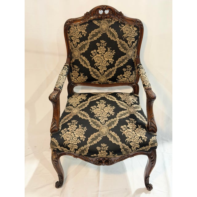 This is a distinguished vintage Louis XV style armchair showcasing refined craftsmanship and elegant European influence....