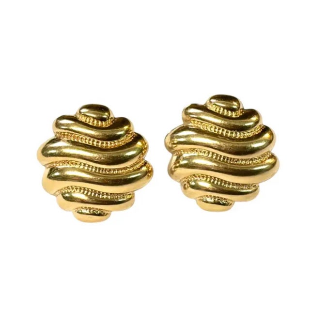 Vintage Pair of 14K Yellow Gold Sculptural Earrings. Crafted in polished gold, these earrings feature a distinctive series...
