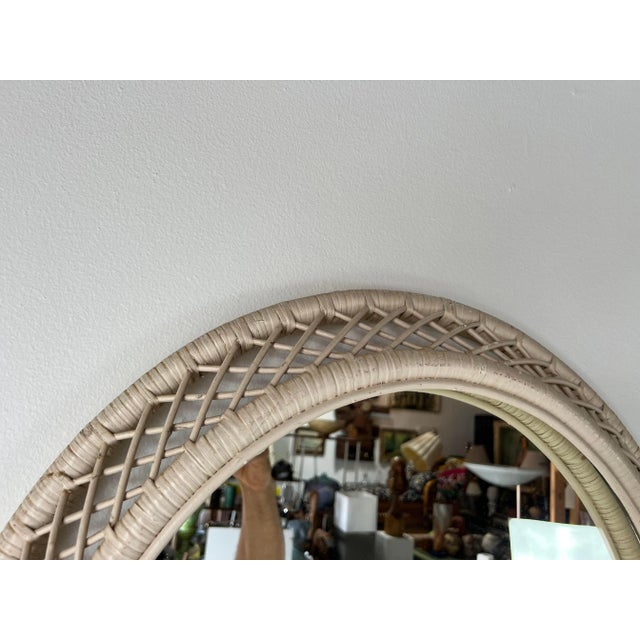 For your consideration we are presenting for sale this fantastic Vintage rattan frame oval wall mirror. Painted in a white...