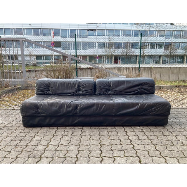 Wittman leather sofa daybed. Black leather. Folds out to create a guest bed for two people. Vintage condition. Dimensions...