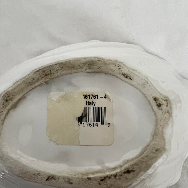 Italian white ceramic shell mold cachepot. Measures 8” w x 5.5” d x 3.75” h.