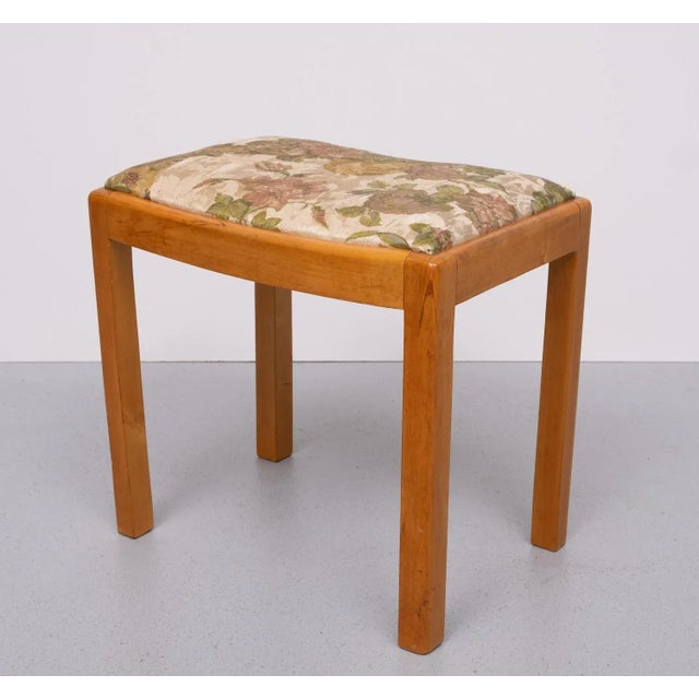 Solid Beech wood foot stool or Ottoman. Comes with a Silk Flower upholstery. 1950s Dutch. Good condition.