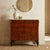 Mahogany chest of drawers. Four drawers in front, the first of which is smaller, with forty-five-degree uprights and...