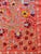 Hand-embroidered Suzani panel from Uzbekistan — two crowned white peacocks among dark red pomegranates and blue-grey...