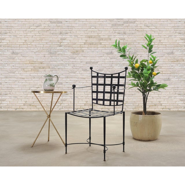 An elegant Italian mid-century modern wrought iron patio and garden dining armchair in the style of the 'Amalfi' chair...