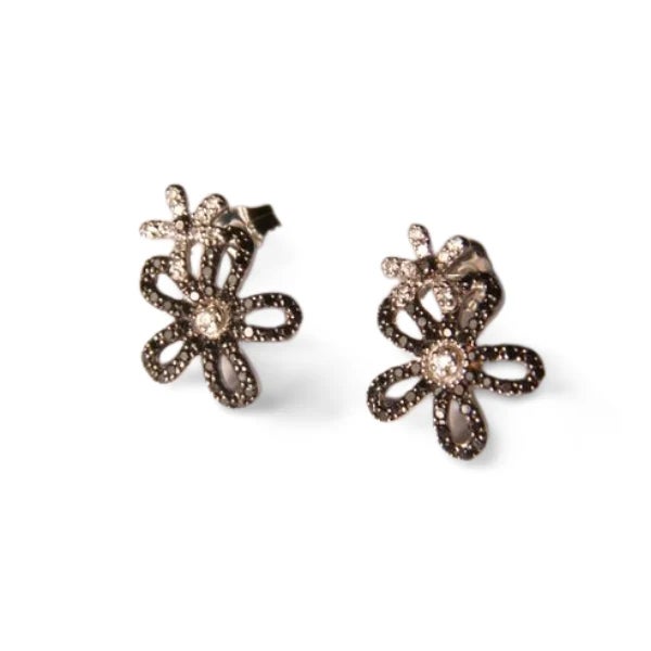 14K white gold floral earrings featuring black pave diamonds and brilliant round white diamonds, totaling 0.5 carats. Each...