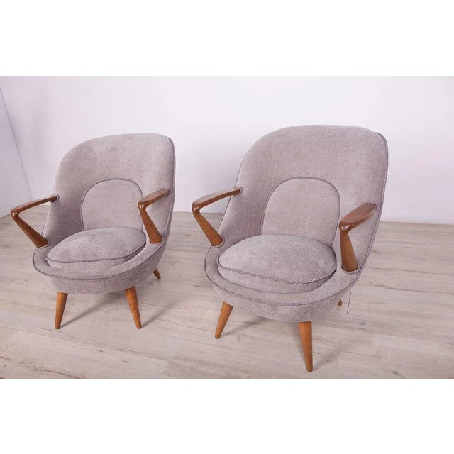 Armchairs designed by Janina Jędrachowicz and Konrad Racinowski manufactured by Poznan Furniture Factory. The armchairs...