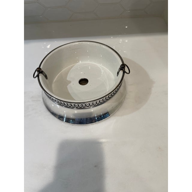 Unusual Flower Planter that is silverplate with a ceramic insert. Made by Wallace Brothers in the 1940s. The ceramic...