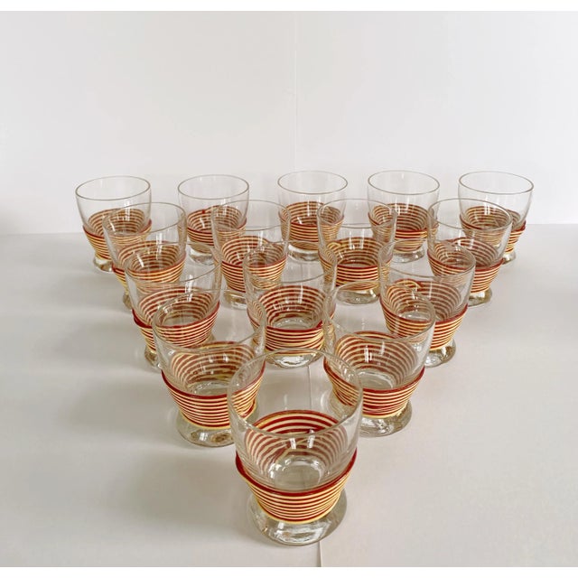 Cool, retro, mid-century bar glasses and small pitcher. The beige/maroon striped wrapping give this set a muted colorful...