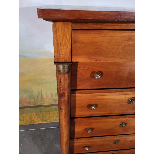 Chest of drawers, large chest of drawers in solid cherry from the 19th century. This “empire” model has detached columns....