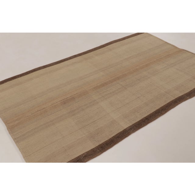 Handwoven in wool, this 5x8 contemporary kilim is a sophisticated addition to Rug & Kilim’s curation. This brand-new piece...