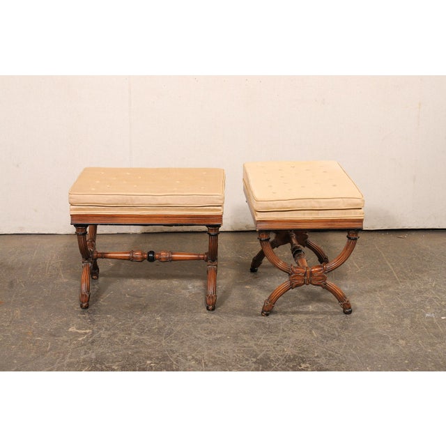 A pair of Dante style wooden stools, with upholstered seats, from the mid 20th century. These vintage American-made stools...