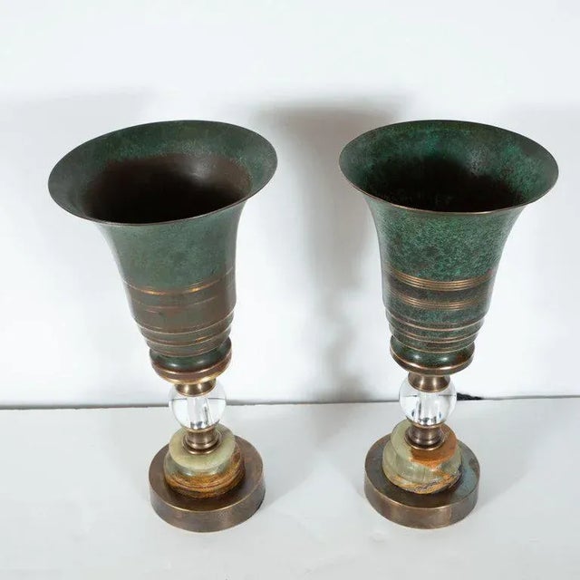 This stunning pair of Machine Age Art Deco uplights were realized in the France, circa 1935. They feature skyscraper style...