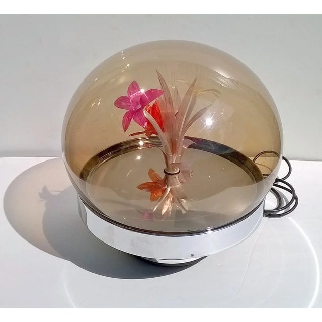 Incredible psychedelic italian lamp in plexiglass. Inside the lamp, a motor rotates the inner base and at the same time...