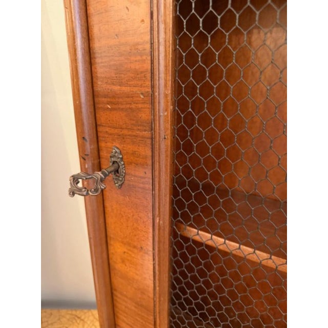 This is a vintage wall curio made in Italy, of walnut and walnut veneer. This has a very special feel with 2 shelves and a...