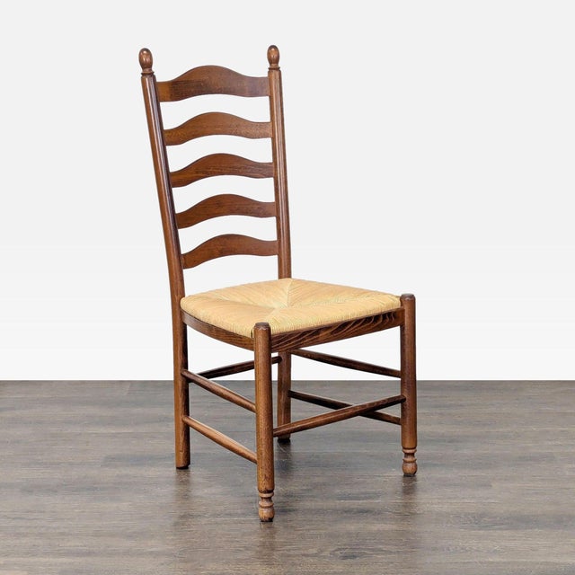 Italian-made chair with rush seat. Brand: Pottery Barn. Dimensions (in): 20W x 21D x 43H.