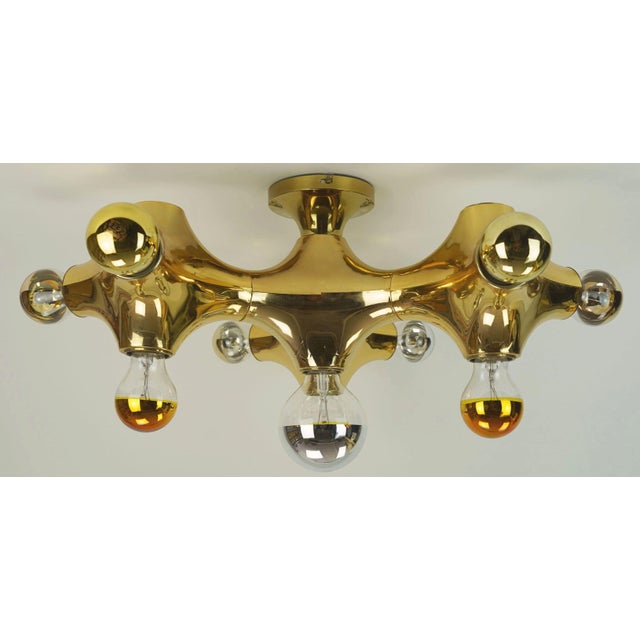 Space age ceiling light by cosack-leuchten (model gemini) from the 1970s. The body is made of gold-colored coated plastic....