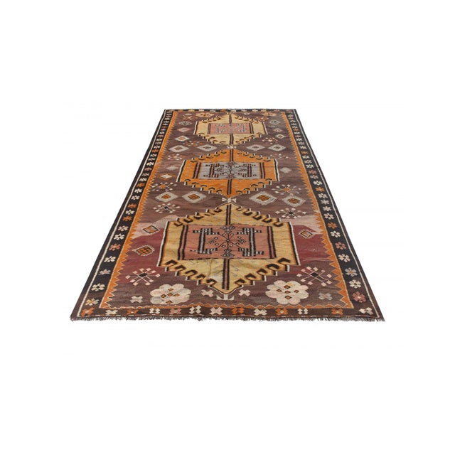 Vintage handwoven decorative kilim rug from Kars region of Turkey. Approximately 50-60 years old. In very good condition.