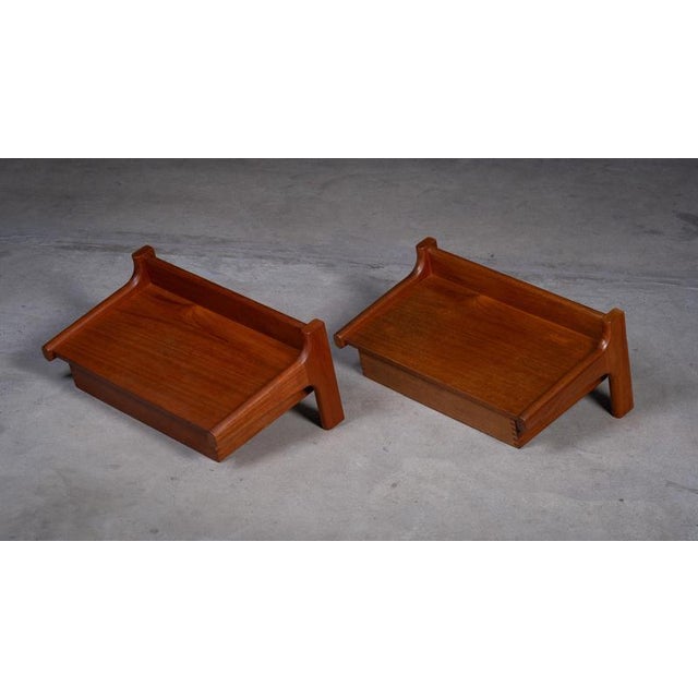 Pair of wall-mounted teak bedside tables attributed to Børge Mogensen and produced by Dyrlund in the 1950s. Timeless...