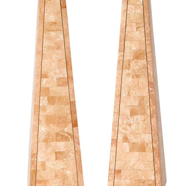 An impressive pair of large decorative tessellated stone obelisks, dating to the third quarter of the 20th century. Each...
