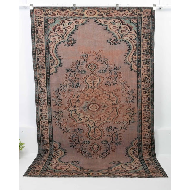Vintage Turkish Hand-Knotted vintage rug is a semi-antique vintage Area rug.'70s Eastern region of Turkey's unique rug is...
