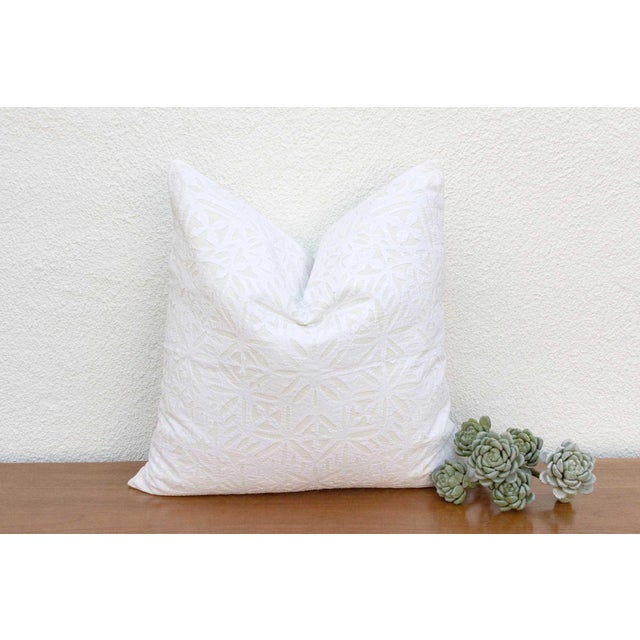 This decorative pillow cover features beautiful array of patterns, with hand crafted appliqué cut work, giving it a...
