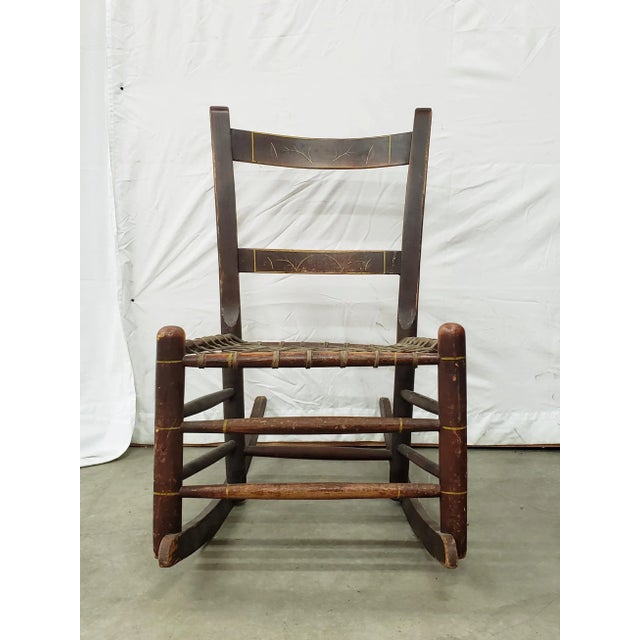 This is an antique rocking chair. The chair is a smaller adult size and measures about 32" tall, 19.5" wide, and 28" deep....
