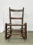 This is an antique rocking chair. The chair is a smaller adult size and measures about 32" tall, 19.5" wide, and 28" deep....