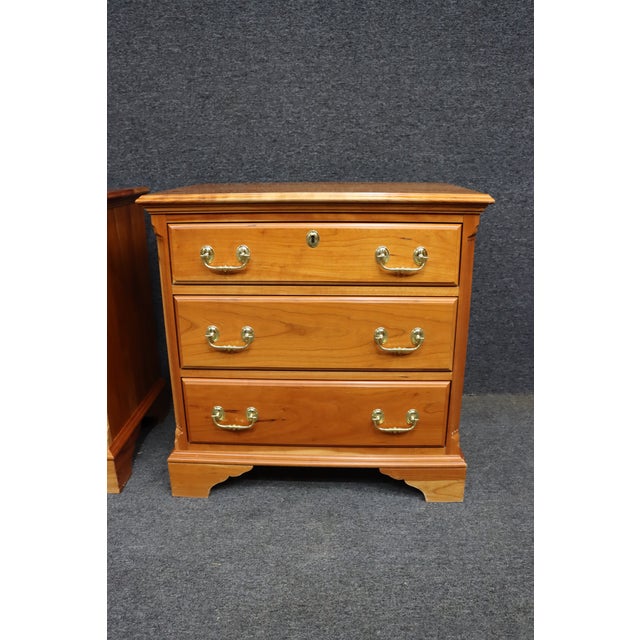 Pair of nightstands by Harden, crafted in solid cherry with a warm, even finish that highlights the natural grain. Each...