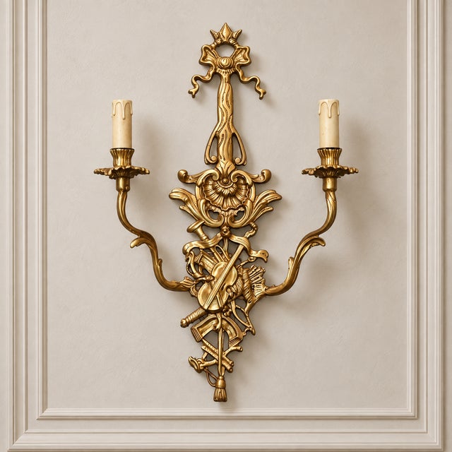 Make a dramatic statement with this ornate French-style two-light wall sconce, featuring an elaborate sculptural design...