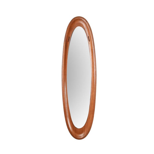 Amazing midcentury teak wood elliptical wall mirror. This fantastic piece was designed by Franco Campo and Carlo Graffi in...