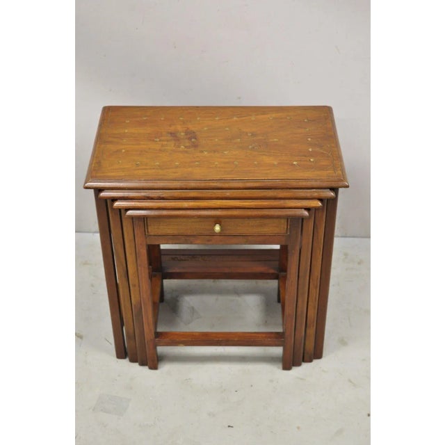 Antique Brass Inlay Marquetry Nesting Side End Tables - Set of 4. Item features a brass floral and scrollwork inlay, (4)...