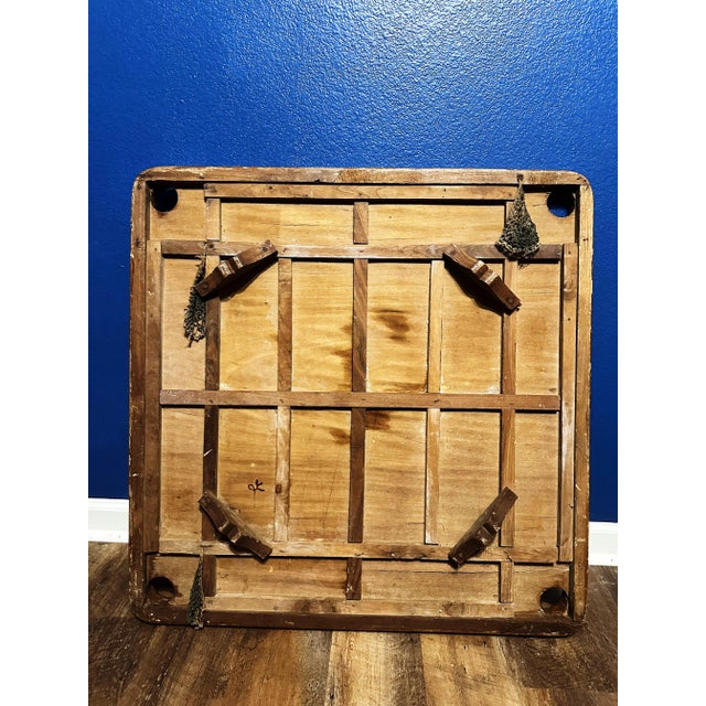 This vintage Carrom board, measuring 32.5x32.5 inches, is a captivating piece that encapsulates the joy and camaraderie of...