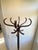 Beautiful 12-hook coat rack with a distinctive "parrot" design. Exquisite French craftsmanship in the vintage Baumann...