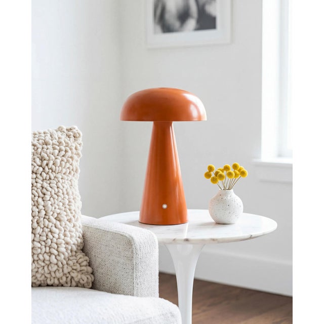 Illuminate your space with the chic and portable Umbra accent table lamp, a beacon of minimalist modern style. Standing at...