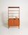 Teak bookcase with open upper shelving and a lower cabinet with sliding doors. Swedish production, 1950s/1960s. Made in...