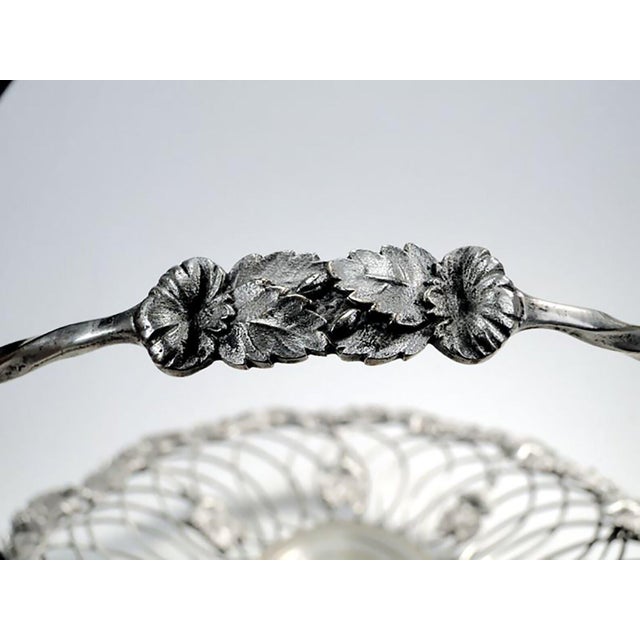Fruit basket produced around 1907-1915 in Warsaw by the Norblin factory. It was made of white plated metal. It has the...
