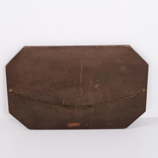 Rectangular mirror with a dark wood frame dating from the 1940s. It features a simple classic design suitable for a...