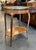 This is an elegant 19th century French Louis XV-style mahogany side table featuring exceptional marquetry throughout. The...