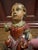 Red 18th Century Polychromed Wooden Santos Sculpture- Christ Child Holding a Sparrow- On Stand For Sale - Image 8 of 10