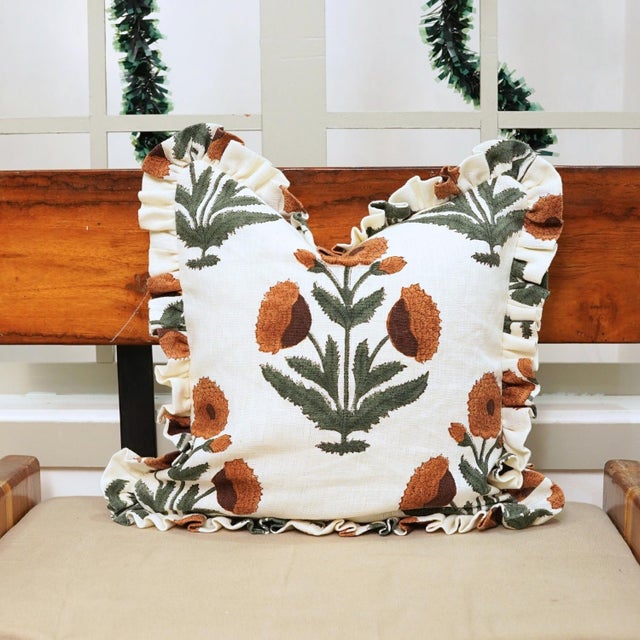 Bring a touch of artisanal charm to your living space with the Badshah Block Print Off-White Linen Boho Frill Pillow Cover...