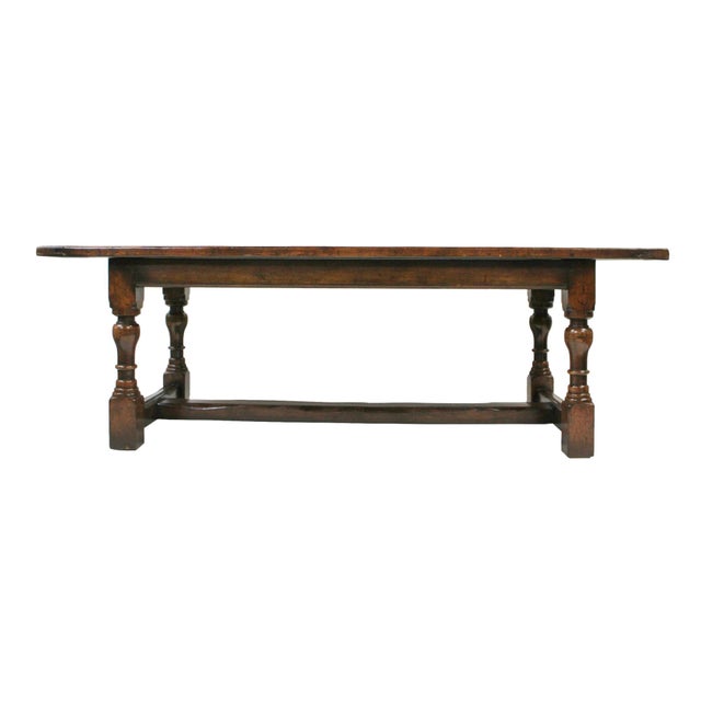 This well-loved English farm table was hand-crafted in the 19th Century. It is made of oak wood that has aged beautifully...