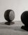 Pair of british antique wooden sculpture globes in black and dark brown stained wood. In good vintage condition....