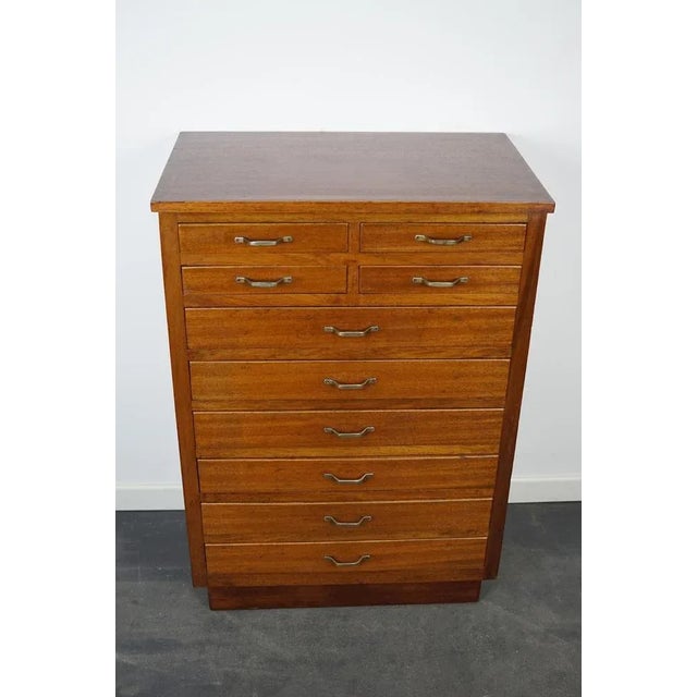 This dentist cabinet was designed and made circa 1930 in Amsterdam, The Netherlands. It features many small mahogany...