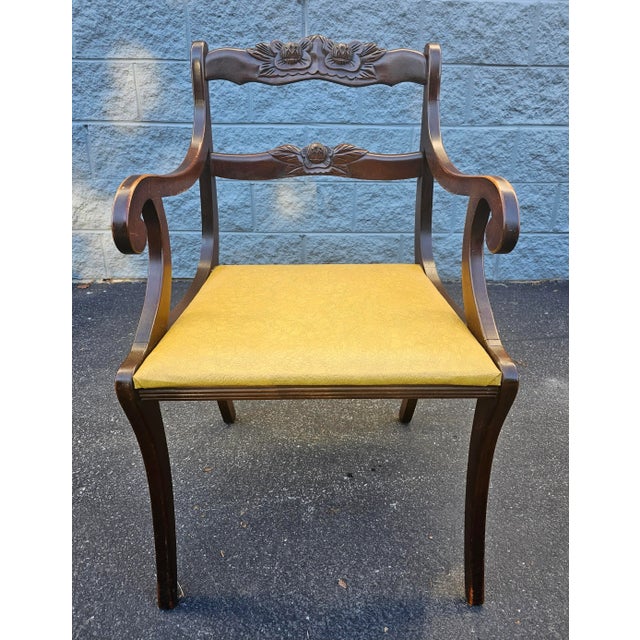A set of 3 Eraly 20th Century Duncan Phyfe carved Mahogany and vinyl Upholstered Seat. Two side chairs measuring 18.5" in...